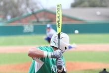 Jake Escalon (15) gets ready to swing at the ball coming across the plate. BA photo by James Norman