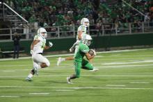 Angel Ruiz runs for a big gain in the first half. Ruiz's run would set the Bucks up near the end zone, but the drive would end in a turnover. BA photo by James Norman