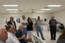 NewVision personnel are greeted by community leaders. In the foreground are Mike Parrack of Breckenridge InterBank, Stan Carstens of Carstens Motor Co., Andy McQuistion, City Manager and standing left to right, Steve Collins of Workforce Solutions,Bill Davidson, ProductionManager at NewVision, Stacy Davidson, office manager, Andy Nuert, Plant Manager for NewVision and Virgil Moore, executive director of the Breckenridge Economic Development Corporation. BA Photo by Jean Hayworth
