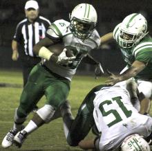 Breckenridge senior running back Zach Willis runs for a 22-yard touchdown, his second after returning an interception 35 yards for a TD in the second quarter.
