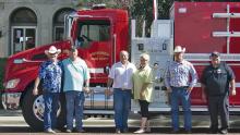 From left, Stephens County Commissioners Rick Carr, Ed Russell, Judge Gary Fuller, Darlene Taylor with Deep South Fire Trucks Commissioner Will Warren and Breckenridge Fire Department Chief Calvin Chaney pose for a photo in front BFD’s  new tanker.