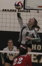 Sophomore Madison Stanley slams the ball past Jim Ned defenders during  UIL Bi-District Playoff Game in Abilene. The Lady Buckaroos fell in five sets.