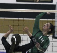 Breckenridge senior middle blocker Makenna Moser pulls back to spike the ball during a game against Comanche.